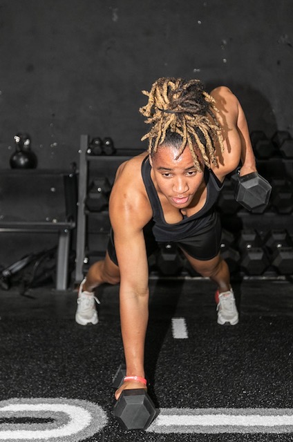 BFE athlete training with dumbbells at Thrive Fitness